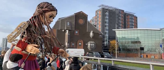 Giant puppet Little Amal on the streets of Glasgow