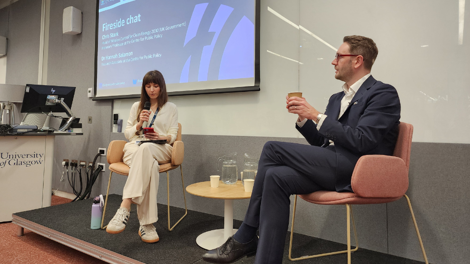 A photo of Hannah Salamon in conversation with Chris Stark