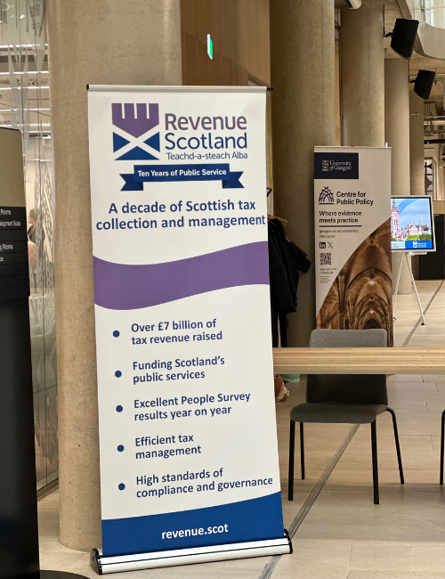 A photo of the Revenue Scotland banner next to the Centre for Public Policy banner