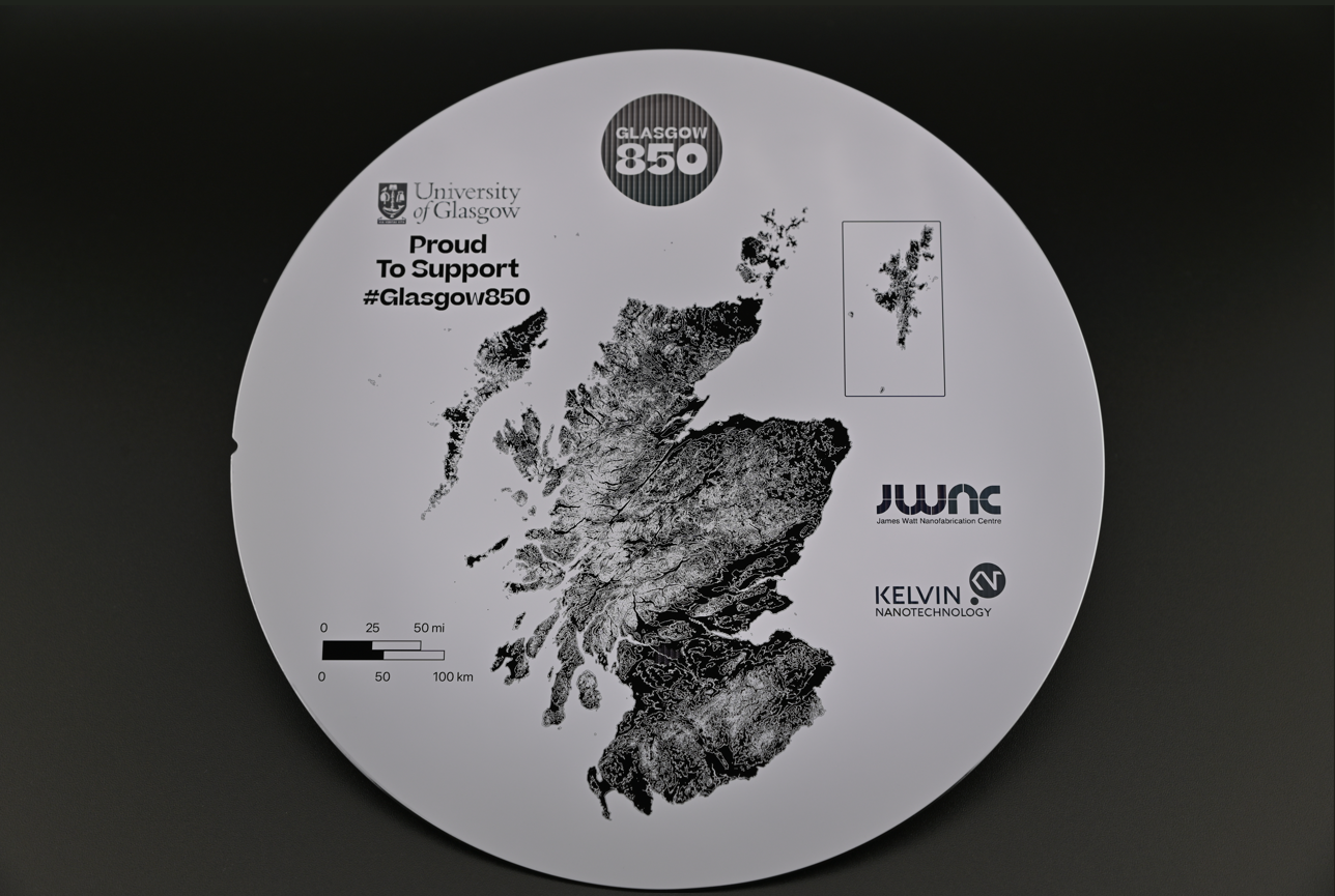 Image of the 850 Commemorative Wafer Created for Glasgow City Council by the JWNC. The wafer includes JWNC and KNT logos, and a map of Scotland, with Glasgow being a reflective element.