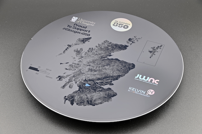 Image of the 850 Commemorative Wafer Created for Glasgow City Council by the JWNC. The wafer includes JWNC and KNT logos, and a map of Scotland, with Glasgow being a reflective element.
