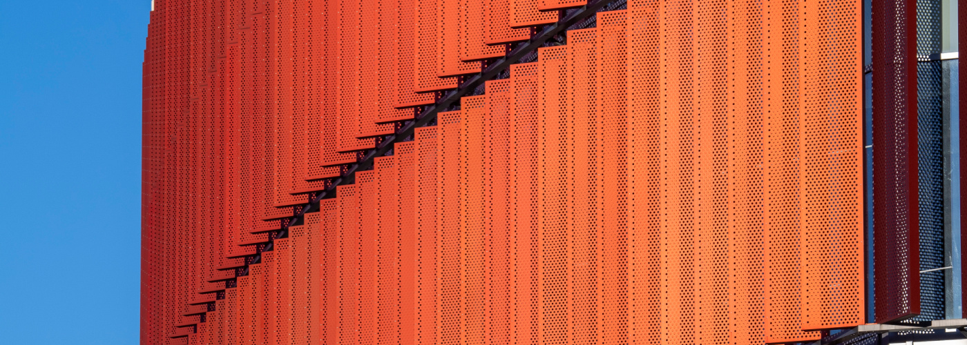 A photograph taken on a sunny day showing a section of the design on the front of the James McCune Smith Learning Hub