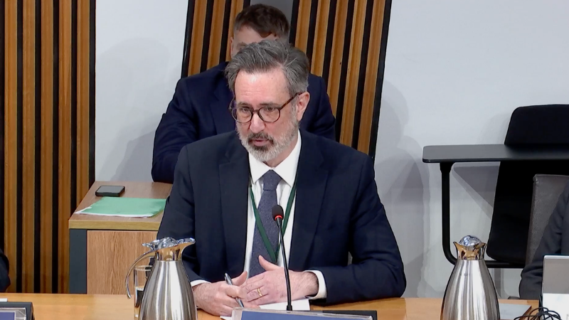 Dr Ian C. Elliott giving evidence in Parliament
